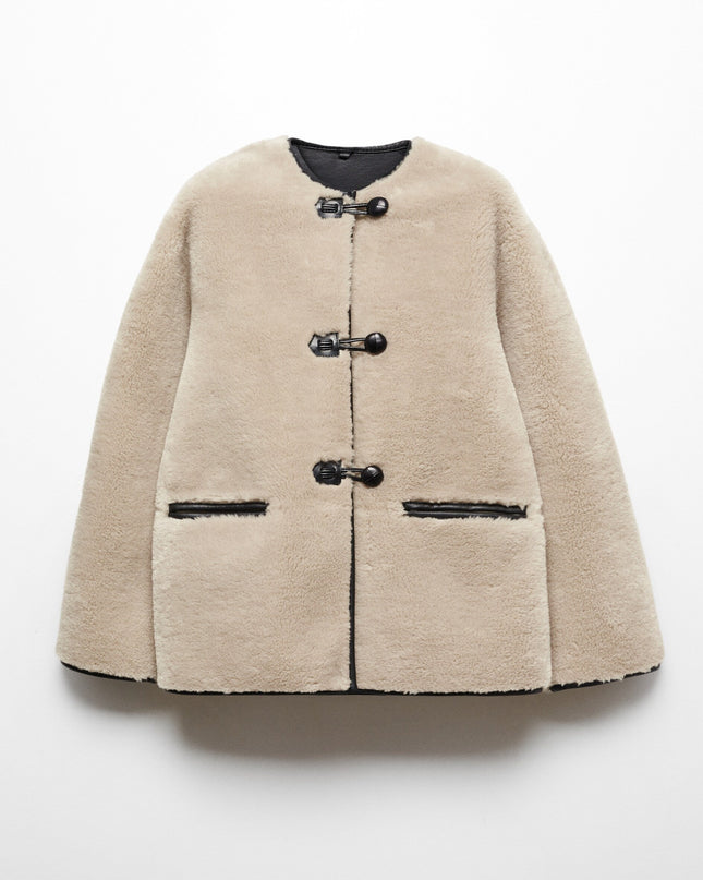 Faux fur coat with applications