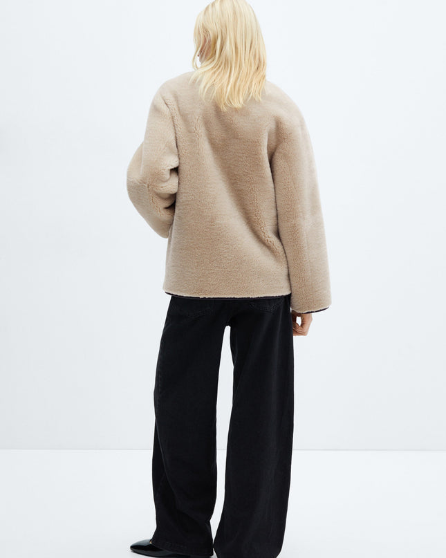 Faux fur coat with applications